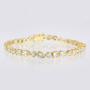 Mixed‑Shape Bezel CZ Bracelet displayed in a circle on a reflective surface.