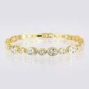 High Quality Fine‑Cut Oval Large and Small CZ Tennis Bracelet displayed in a circle on a reflective surface.