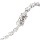 A close-up of a silver-toned tennis bracelet featuring pear-cut and marquise-cut clear stones in a continuous line setting, shown against a plain white background.