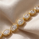 4 mm oval CZ tennis bracelet close-up picture on a fabric.