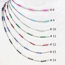 Fourteen beaded chains labeled #8 through #14, each made of silver beads with small colored beads in different color combinations, displayed on a white background.