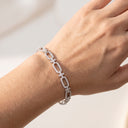 High Quality Fine‑Cut CZ Link Bracelet displayed on a woman's hand.