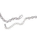 A silver-toned bracelet featuring a row of teardrop-shaped clear gemstones in a silver setting, shown with its lobster clasp and extension chain on a plain white background.