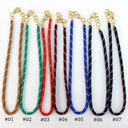 Seven braided rope-style wristlets or lanyards in different colors are shown on a white background, each with gold-tone hardware and labeled #01 through #07.
