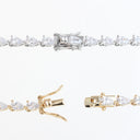 A tennis bracelet shown in three close-up views on a white background: a full section with pear-cut clear stones in a silver-toned setting, a clasp detail in silver-toned metal, and a clasp detail in yellow-gold metal.