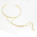 A gold-toned metal choker necklace with a delicate chain drape and small clear gemstone accents, displayed on a clean white background.