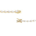 A yellow gold tennis bracelet featuring pear-cut clear gemstones in a continuous link design, shown in two close-up views against a plain white background.