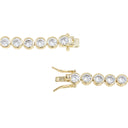 A pair of yellow gold tennis bracelets shown on a plain white background, displaying both the front view with five clear round-cut stones and the clasp detail.