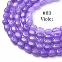 Purple oval gemstone beads, labeled '#03 Violet', arranged in a curved row on a plain white background.