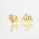 A pair of gold stud earrings with a textured, ridged shell-like design, displayed on a reflective white surface against a white background.