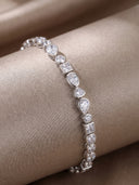 Mixed‑Shape Bezel CZ Bracelet displayed round on a grey fabric tube.