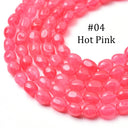A close-up of a strand of hot pink, translucent oval beads on a white background, with the text '#04 Hot Pink' printed in black.