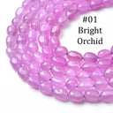 A coiled strand of smooth, oval beads in a bright pinkish-purple shade, labeled '#01 Bright Orchid' on a clean white background.