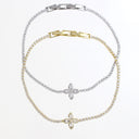 Two delicate chain bracelets with diamond-like clear stones and clover-shaped flower pendants, shown on a clean white background. One bracelet is silver-toned and the other is gold-toned, with one bracelet featuring both metals.