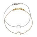 Two delicate chain bracelets with crescent moon charms, one in yellow gold and one in silver, both adorned with small clear stones, shown on a plain white background.