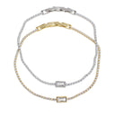 Three tennis-style bracelets with rectangular baguette-cut clear stones, shown in silver, yellow gold, and two-tone silver and gold finishes on a white background.