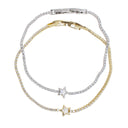 A double-strand tennis bracelet set featuring one silver-toned bracelet and one yellow gold-toned bracelet, both adorned with clear cubic zirconia stones and a matching star charm.