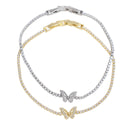 Two double-strand tennis-style bracelets with butterfly charms, one in yellow gold and one in silver, both set with clear stones, shown on a white background.