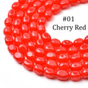 A close-up of glossy cherry red oval beads arranged in a curved coil on a white background, with the text '#01 Cherry Red' printed over the upper right area.