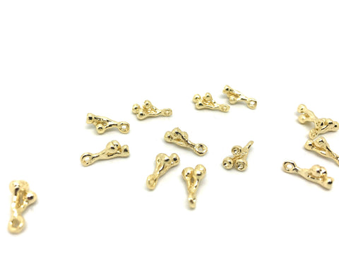 Delicate gold lotus stem pod charm
