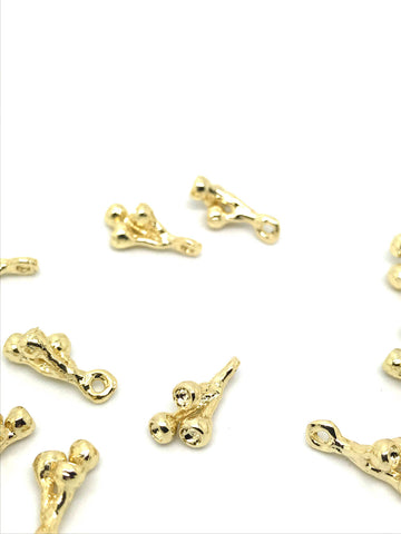 Delicate gold lotus stem pod charm